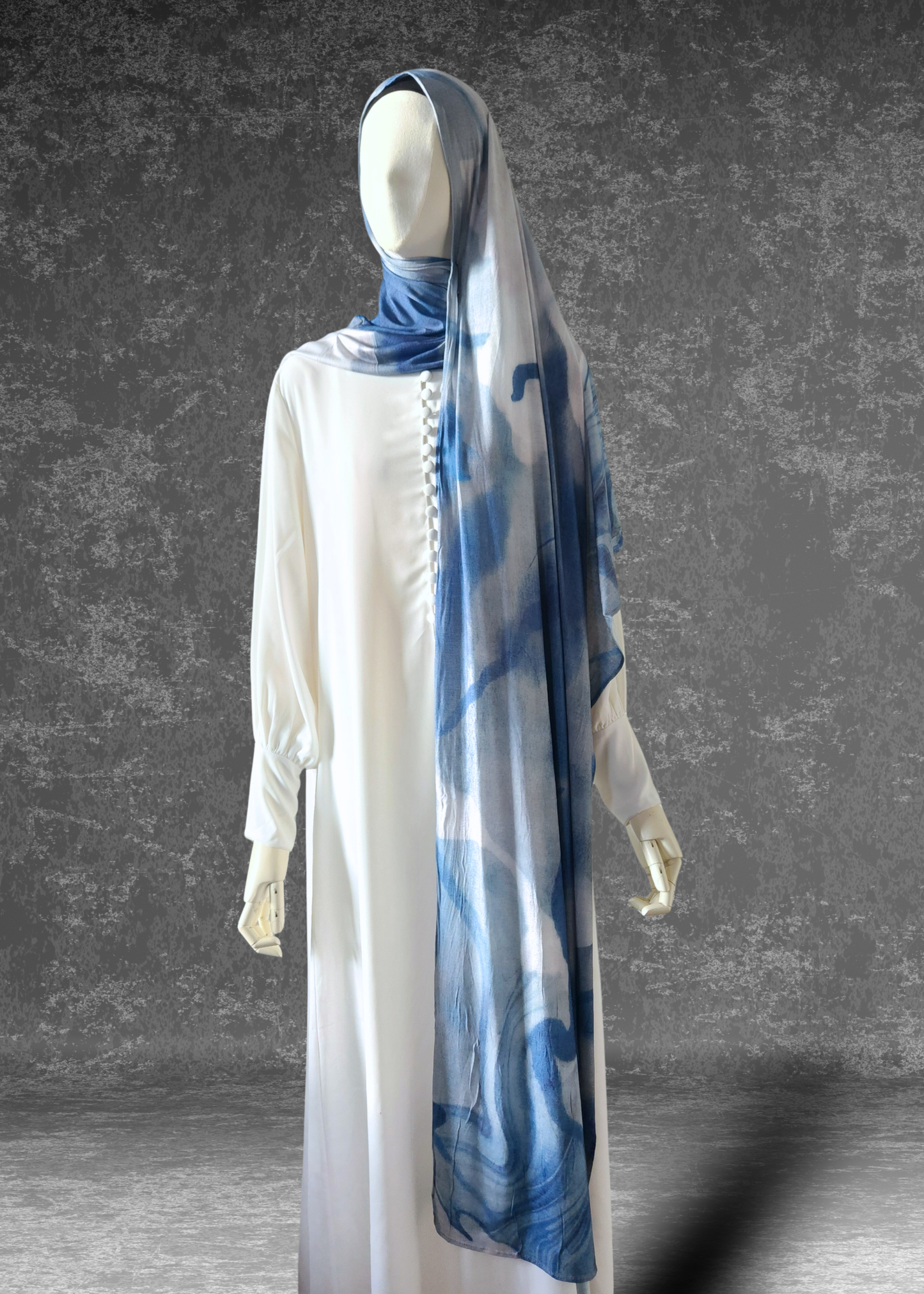 Discover the Celestial Tide Printed Jersey Hijab. A dreamy blue watercolor design on breathable, 4-way stretch fabric. Soft, stylish, and perfect for every day.