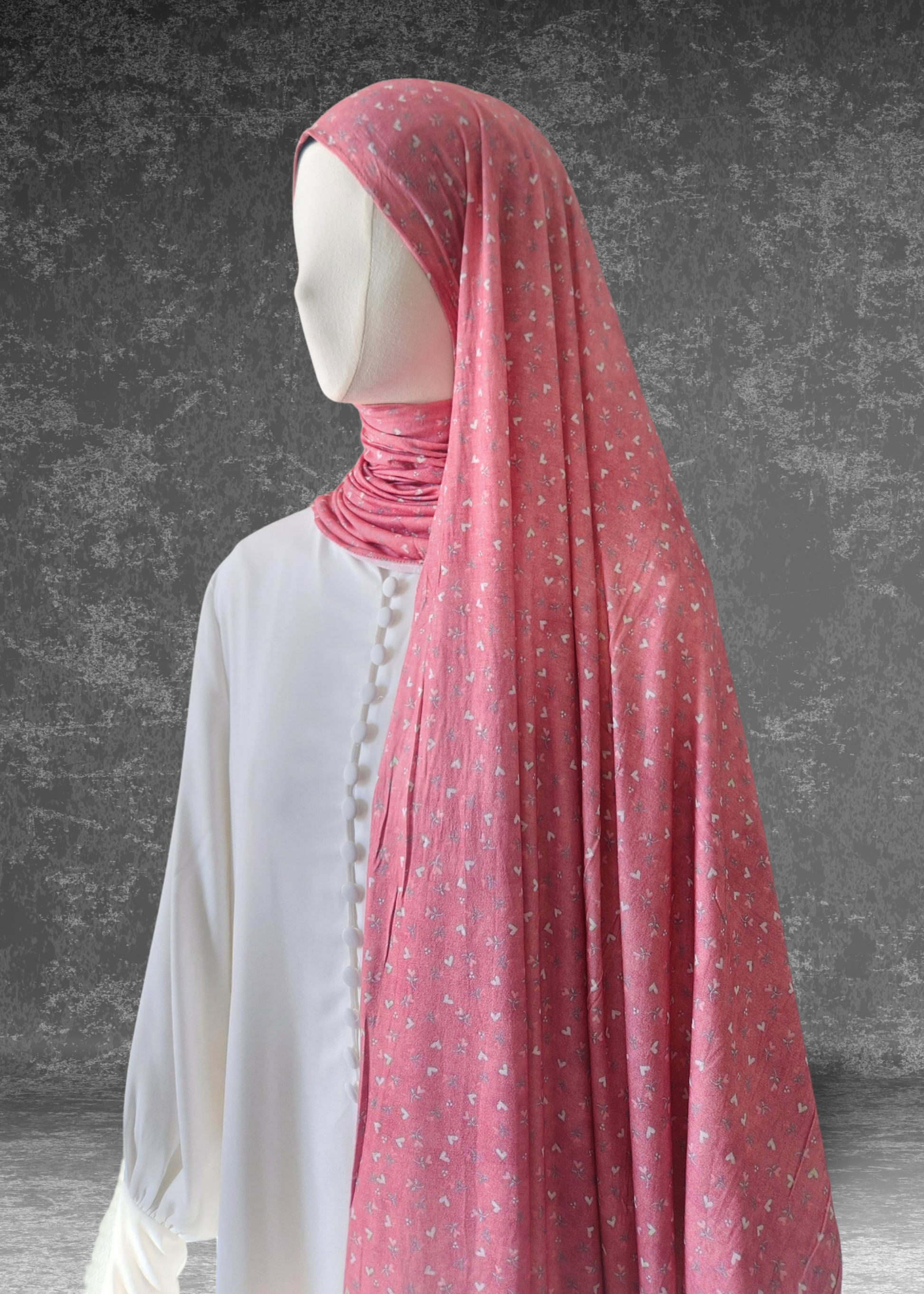 Sweetheart Pink soft printed jersey hijab with a tiny white heart and floral pattern on a vibrant pink base.