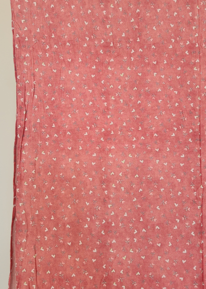 Sweetheart Pink soft printed jersey hijab with a tiny white heart and floral pattern on a vibrant pink base.