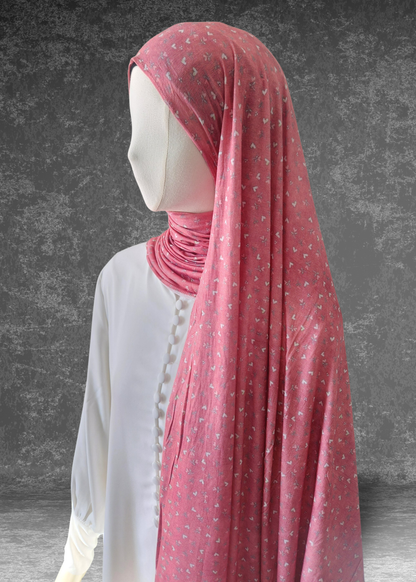 Sweetheart Pink soft printed jersey hijab with a tiny white heart and floral pattern on a vibrant pink base.