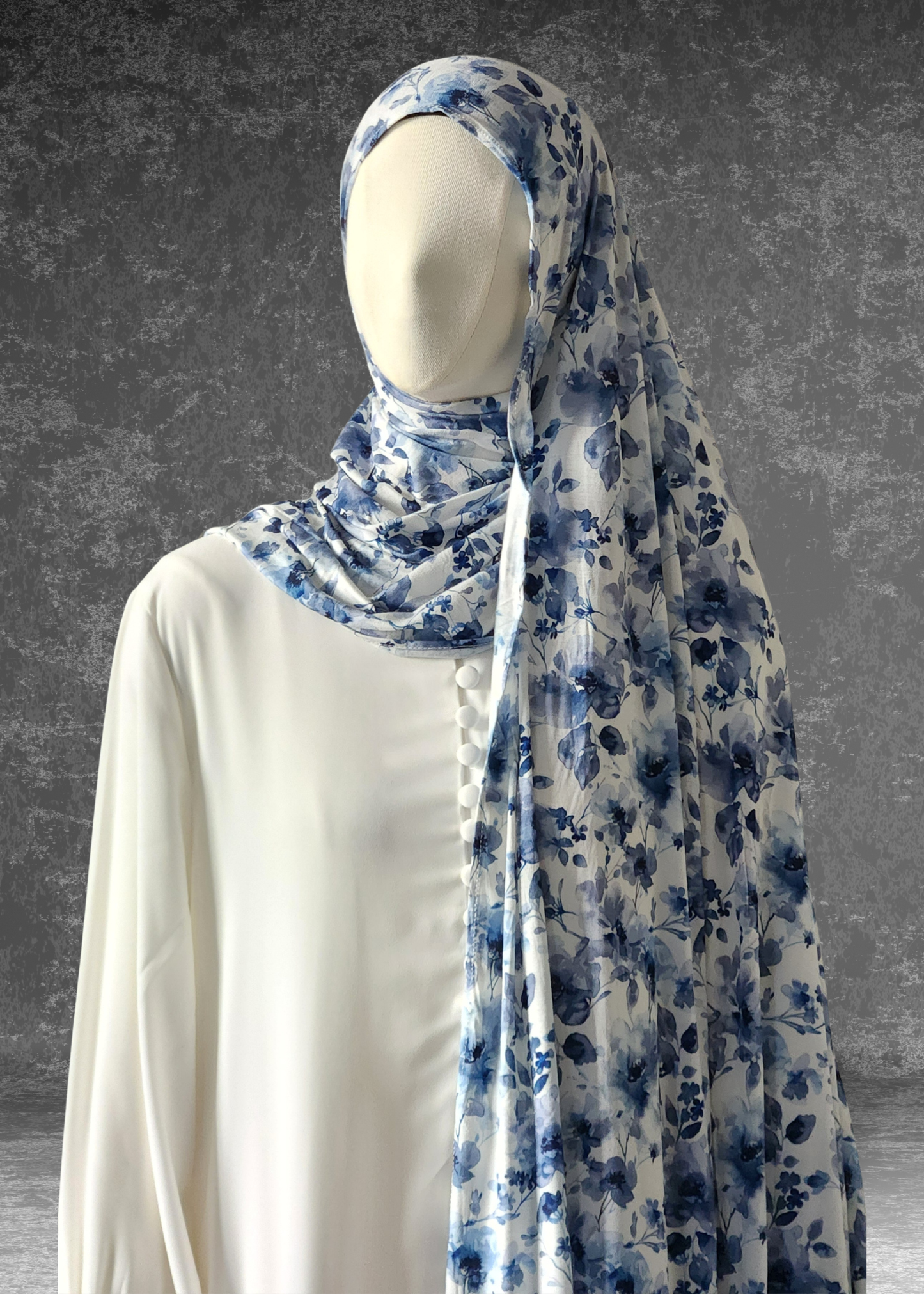 Discover the Celestial Tide Printed Jersey Hijab. A dreamy blue watercolor design on breathable, 4-way stretch fabric. Soft, stylish, and perfect for every day.