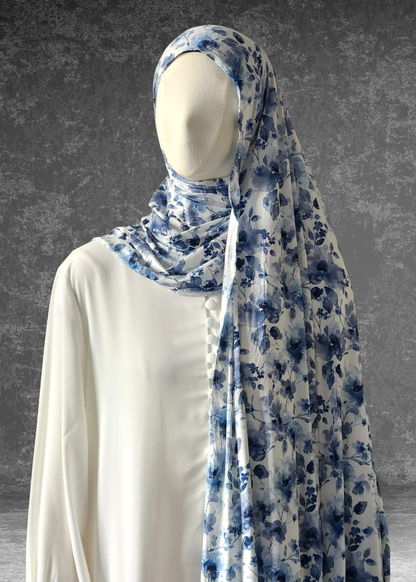 Discover the Celestial Tide Printed Jersey Hijab. A dreamy blue watercolor design on breathable, 4-way stretch fabric. Soft, stylish, and perfect for every day.