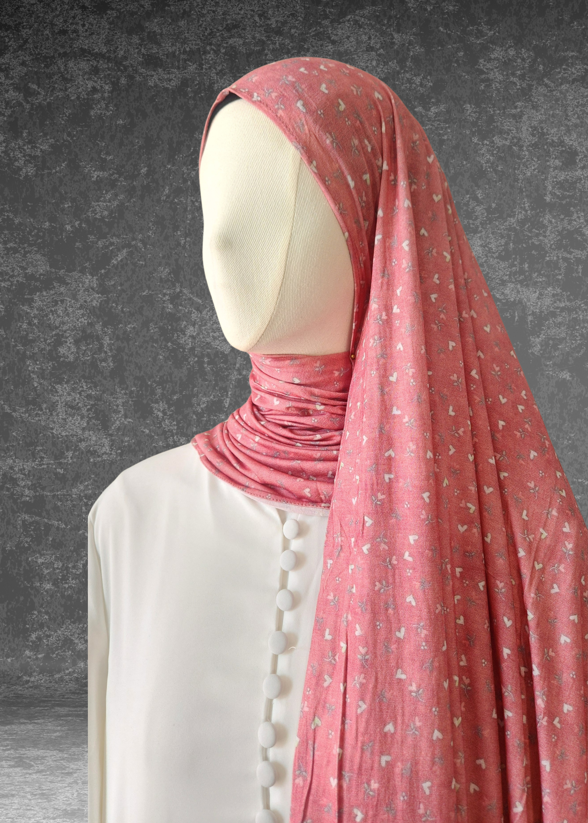 Sweetheart Pink soft printed jersey hijab with a tiny white heart and floral pattern on a vibrant pink base.